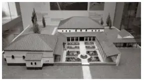 Ein Schwarz-Weiß-Foto eines Modells einer antiken römischen Villa mit Innenhöfen, Säulen, Ziegeldächern und kleinen Bäumen, aus der Vogelperspektive aufgenommen.